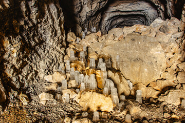 Fascinating ice formations and icicles in Chlum limestone quarry and caves,Czech Republic.Cave system in Cesky kras, Czech Karst.Freezing day outdoors.Wild natural winter scenery.Day trip from Prague