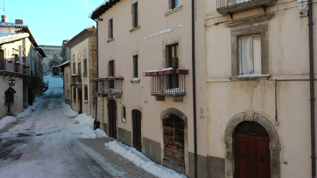 Pescocostanzo, a delightful village in Abruzzo covered in snow
Mountain town with snow. Aerial shot with drone