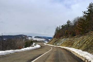 mountain road in winter in the snow