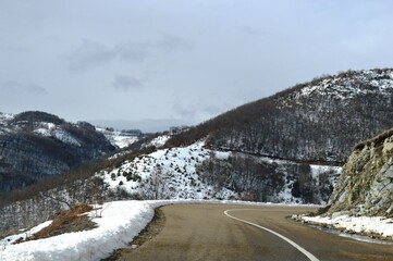 mountain road in winter in the snow