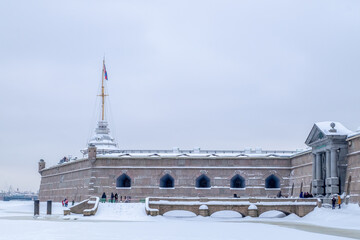 Fototapeta na wymiar St. Petersburg, February 21, 2021. View of the bastions of the Peter and Paul Fortress, the vastness of the Neva River and the city. Selective focus.