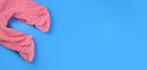 newborn baby clothes over blue background, concept of pregnancy expecting a child, maternity