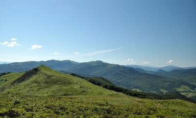 Fototapeta na wymiar green mountain peaks, mountain landscape, blue sky, summer