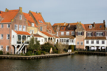 Fototapeta na wymiar Enkhuizen, historic harbor town, traditional old brick buildings with tile roofs