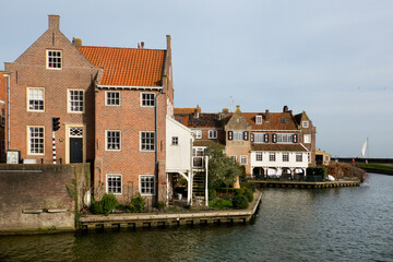 Fototapeta na wymiar Enkhuizen, historic harbor town, traditional old brick buildings with tile roofs
