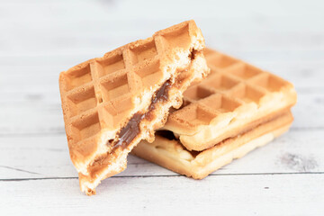 Belgian waffles close up isolated on white background. Delicious, fresh baked goods.