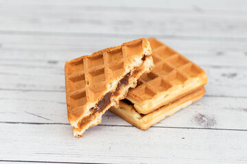 Belgian waffles close up isolated on white background. Delicious, fresh baked goods.