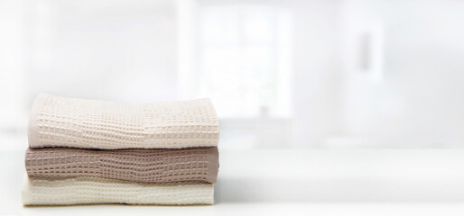  Towel on a wooden table - obrazy, fototapety, plakaty