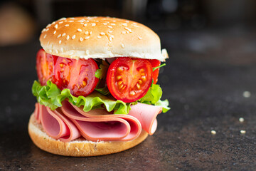 sandwich sausage and tomatoes vegetables burger jamon ham meat portion on the table meal snack outdoor top view copy space for text food background rustic image