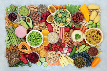 Plant based vegan food for a healthy lifestyle with vegetables, fruit, cereals, grains, nuts, seeds, legumes and dips. High in protein, antioxidants, vitamins, fibre and smart carbs. Ethical eating.