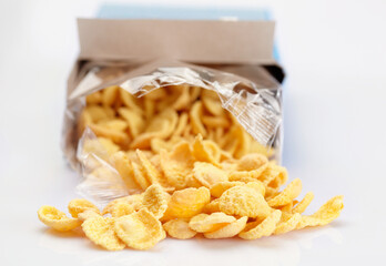 Open pack of corn flakes. Close-up.