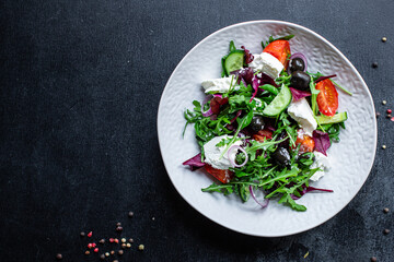 salad vegetable feta cheese mix Greek tomato, cucumber, olives lettuce portion on the table snack top view copy space food background rustic