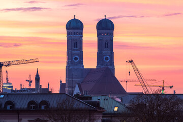 Munich frauenkirche church cathedral time lapse footage at sunset colored sky, munich germany.