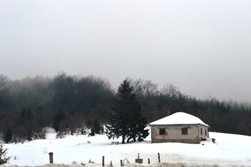 house on the mountain in winter in the snow