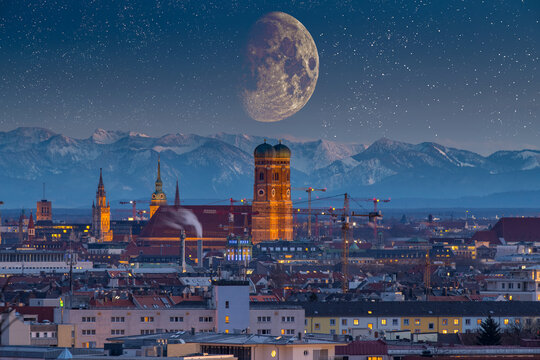 Munich skyline aerial view, munich night old town pre alps mountains.