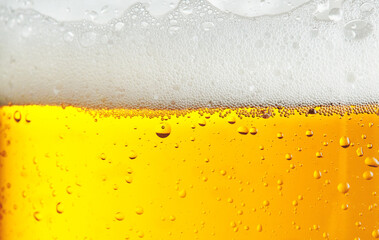 Beer background with bubble froth texture foam pouring alcohol soda in glass happy celebration...