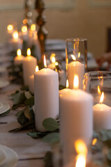 Obraz na płótnie Canvas atmosphere candles at romantic wedding dinner