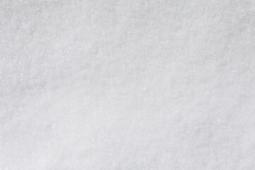 Background, texture of winter white fresh snow. Photo, top view.