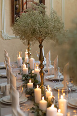 romantic wedding diner with candles in a restaurant
