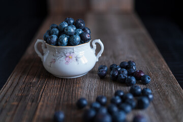 blueberries in a bowl on table