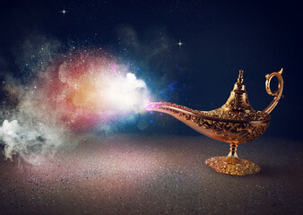 Smoke exists from magic aladdin genie lamp in a desert - obrazy, fototapety, plakaty