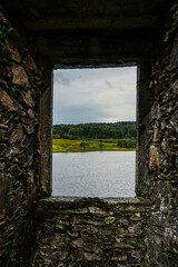View of Scottish landscape framed in old castle window