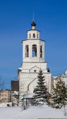 Fototapeta na wymiar bell tower of the Orthodox church in the city