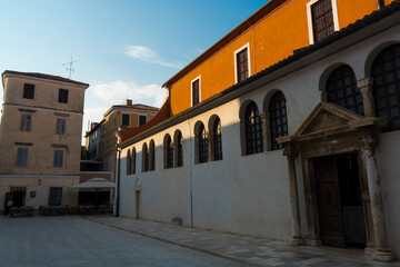 Fototapeta na wymiar Old houses and tower in the old city of Zadar