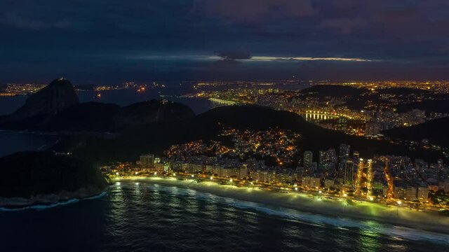 flight over rio de janeiro city famous bay beach twilight night illumination aerial panorama 4k timelapse brasil