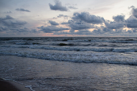 Evening seascape with clouds and waves.