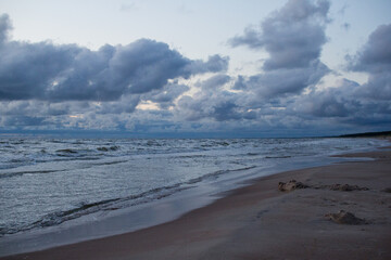 Evening seascape with clouds and waves.