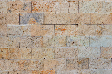 Fototapeta premium Background of the beige travertine tiles