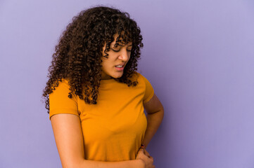 Young african american afro woman isolated having a liver pain, stomach ache.