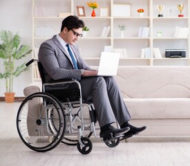 Dsabled businessman on wheelchair working home