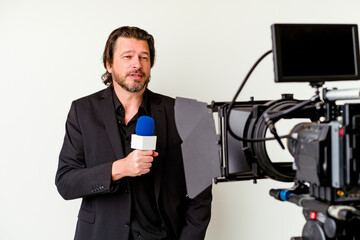 Middle age reporter man with a microhpone