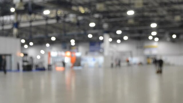 Large open and empty part of a large building inside.