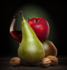 Still life with apples, pears and a glass of wine