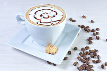Cup of colombian coffee, decorated on white wooden background