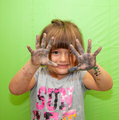 Creative Girl with Paint on her Hands makes a Mess. Green Screen