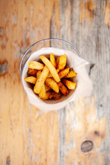 Homemade Potato Fries Serving with cracked black pepper and salt