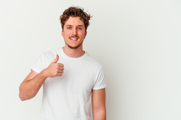 Young caucasian man isolated on white background smiling and raising thumb up