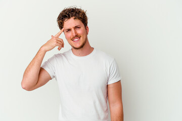 Young caucasian man isolated on white background showing a disappointment gesture with forefinger.