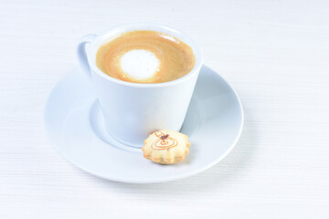 Cup of colombian coffee, decorated on white wooden background