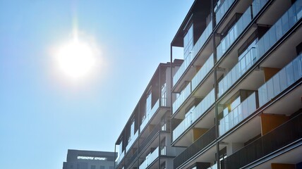 Condominium and apartment building with  symmetrical modern architecture in the city downtown.