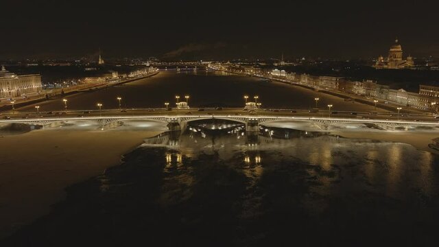 Aerial footage of the winter night city, Blagoveshchensky Bridge, the bridge of the lieutenant Schmidt, a night motionless panorama, St. Isaac's Cathedral, Palace Bridge, the Peter and Paul Fortress