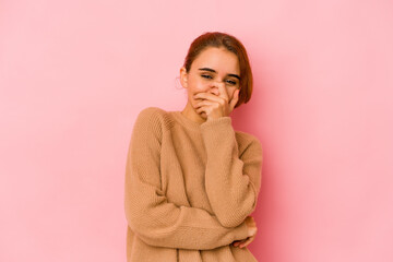 Young arab mixed race woman laughing happy, carefree, natural emotion.