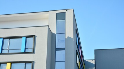 The glass facade of a skyscraper. Modern office building and sky reflection.