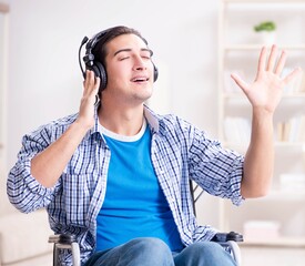 Disabled man listening to music in wheelchair