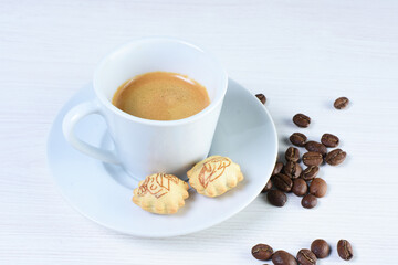 Cup of colombian coffee, decorated on white wooden background