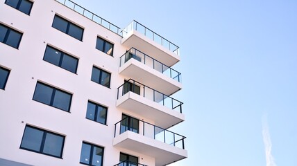 Condominium and apartment building with  symmetrical modern architecture in the city downtown.